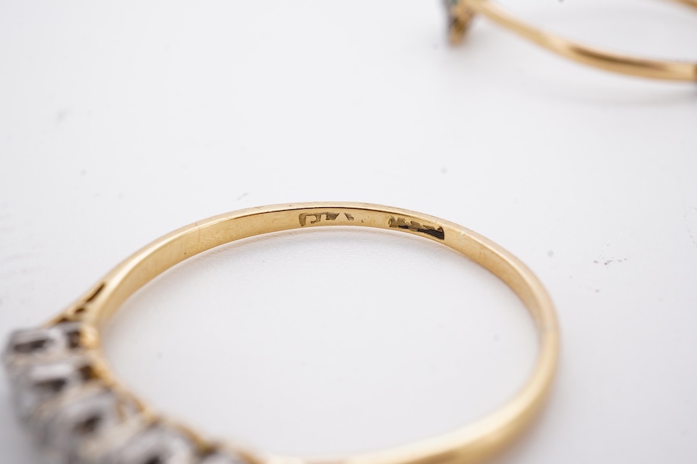 An 18ct and plat. five stone diamond set half hoop ring, size V together with a yellow metal emerald and diamond set tablet ring, size Z+++, gross weight 4.5 grams. Condition - fair